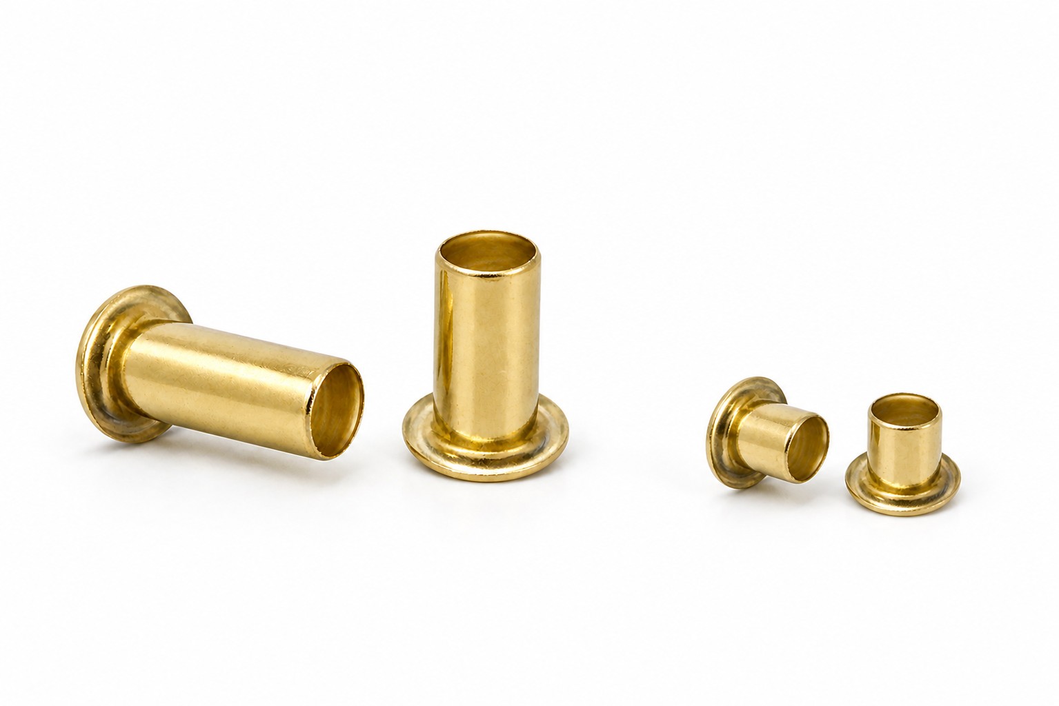 Brass Stimpson GS eyelets in four graduated sizes, showing flange and barrel